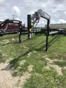 A fence that has some type of construction equipment on it.